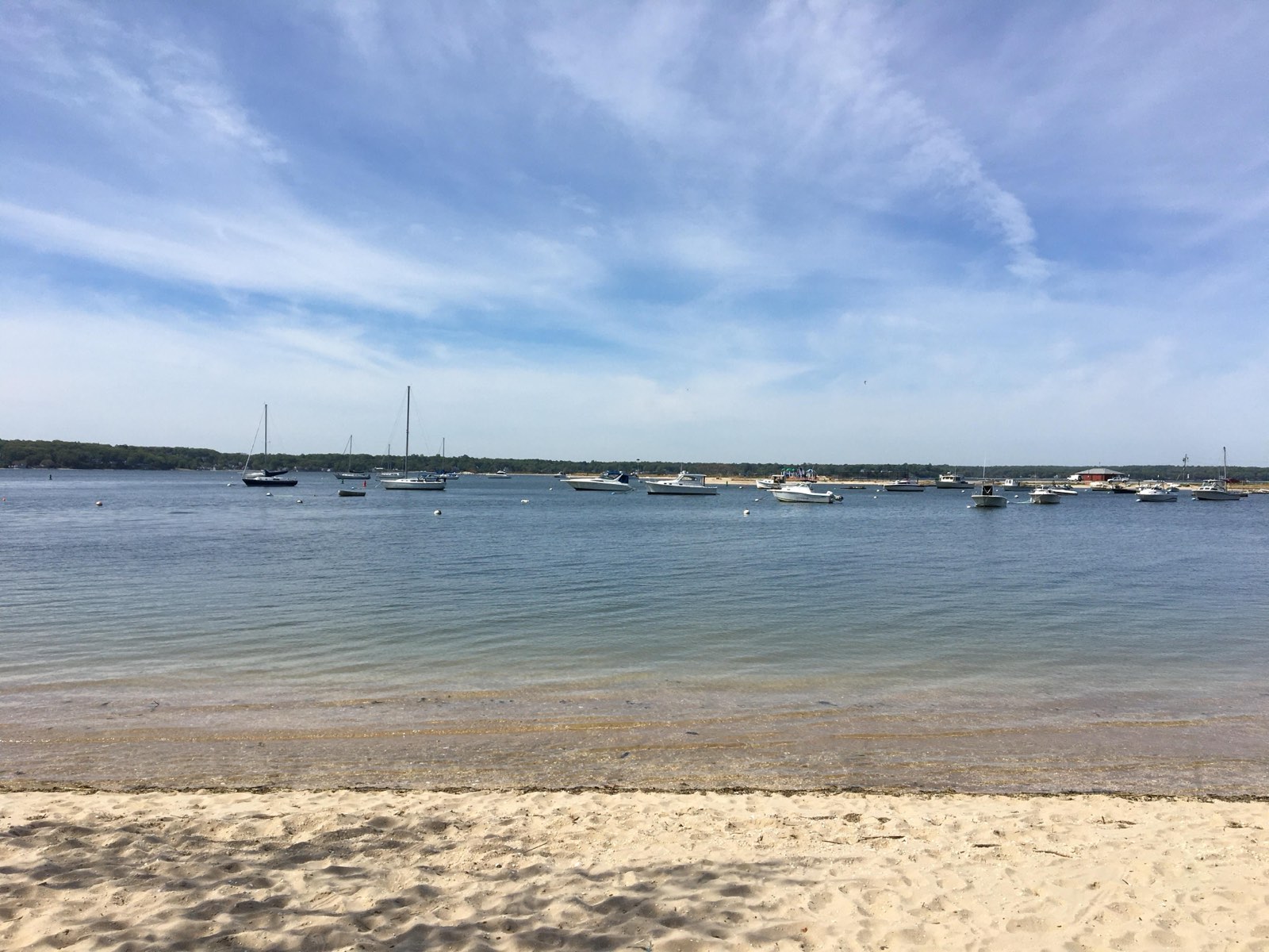 Sandy beach and lighthouse at Eatons Neck on Long Island Sound
